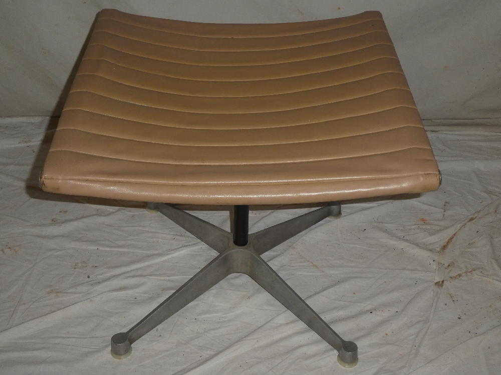 A 1960's aluminium and vinyl Eames swivel easy chair and matching footstool labelled "Eames Design - Image 3 of 4