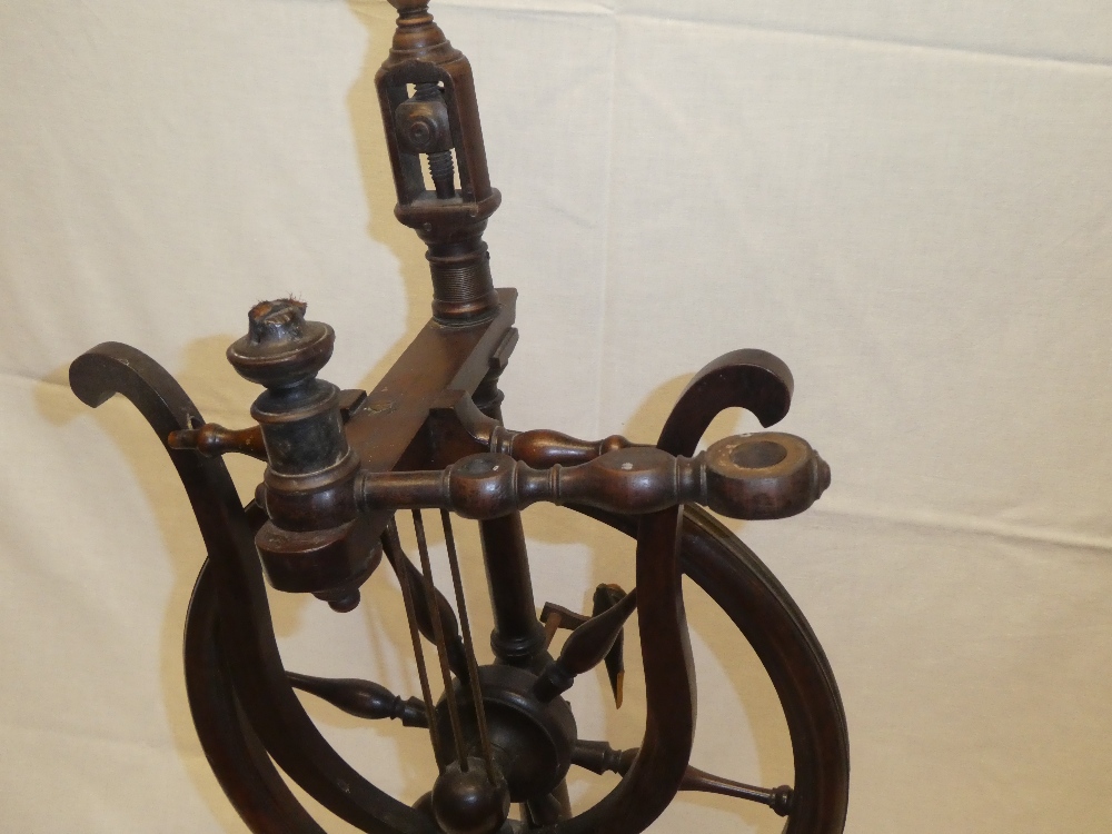 An unusual 19th century mahogany spinning wheel with turned supports 33" high - Image 2 of 2