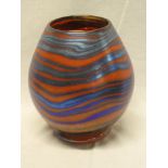 A Cornish art glass vase by Norman Stuart Clarke with orange and blue lined decoration, 6" high,