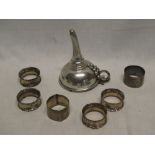 Four matching silver circular napkin rings,