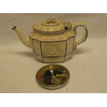 An early 19th century china oval tea pot with raised classical figure decoration and hinged lid and