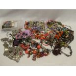 A large selection of various costume jewellery including necklaces, brooches,