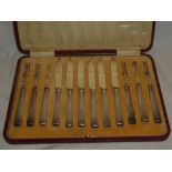 A set of six silver plated tea knives and forks with silver mounted handles, London marks,