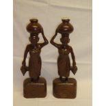 A pair of Burmese carved teak male and female figures 15" high