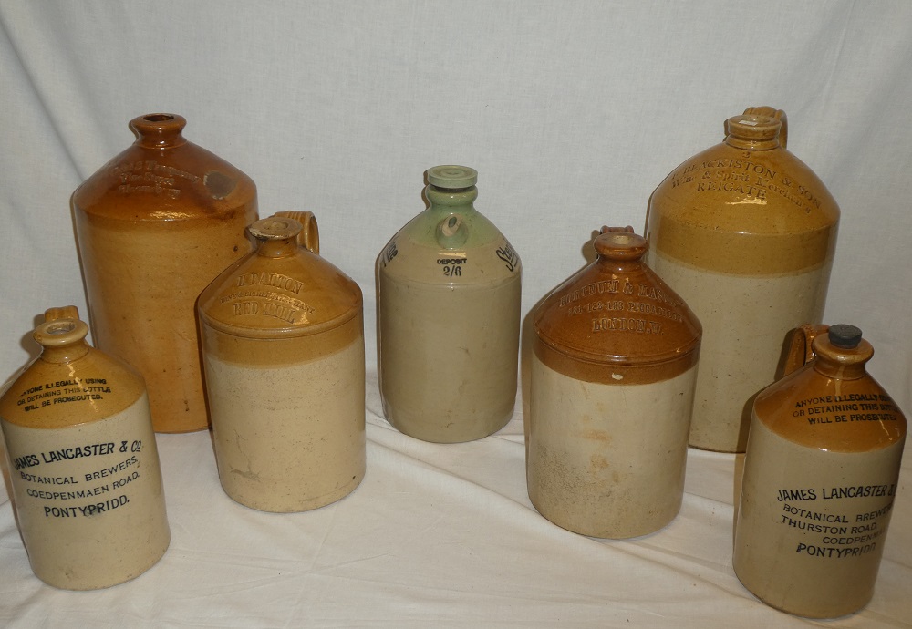 Seven various 19th century and later stoneware flagons including two gallon flagon by Blackiston &