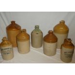 Seven various 19th century and later stoneware flagons including two gallon flagon by Blackiston &