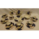 A Victorian china part tea set with floral and blue painted decoration comprising circular teapot,