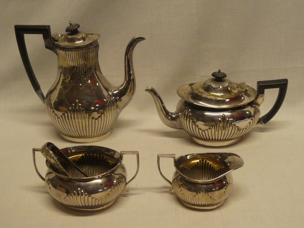 A Victorian silver four-piece tea and coffee set by Mappin & Webb comprising oval tapered coffee