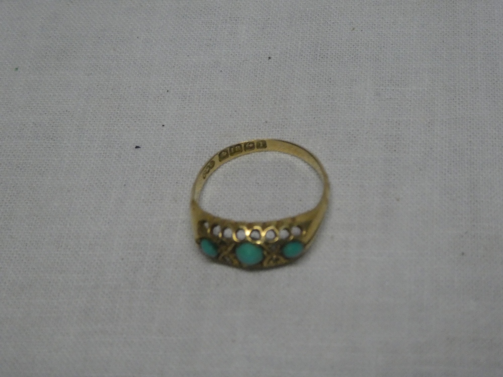 A 18ct gold dress ring set turquoise and diamond chips