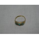 A 18ct gold dress ring set turquoise and diamond chips