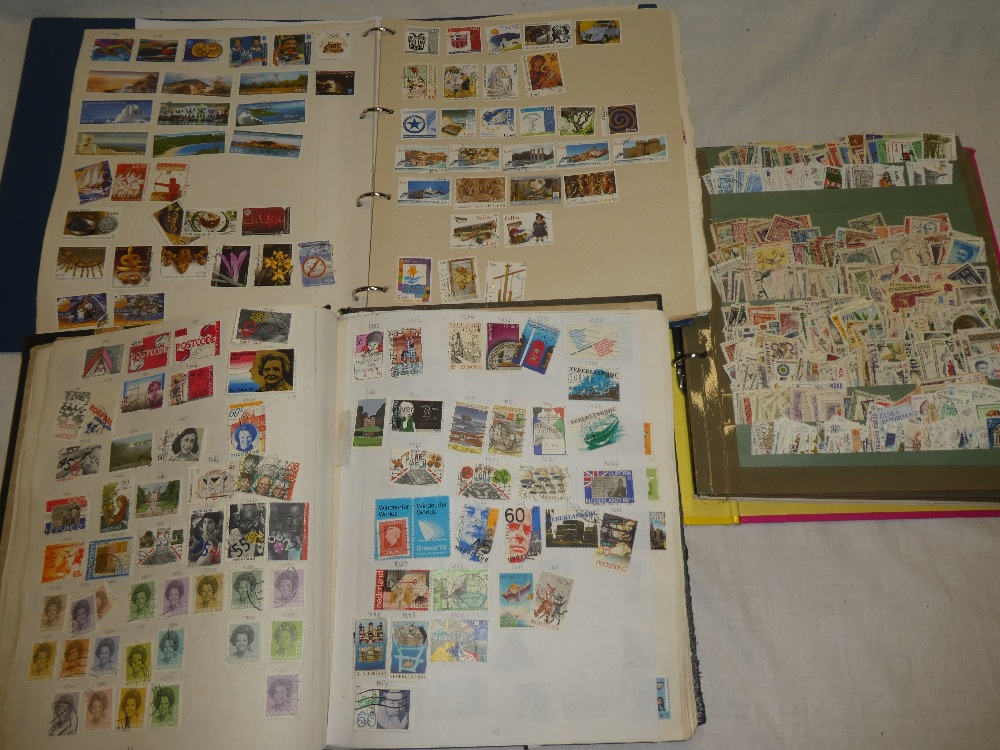 Three albums of World stamps including Latvia, Netherlands, Yugoslavia, Romania,