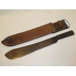 A military issue jungle machete in leather sheath