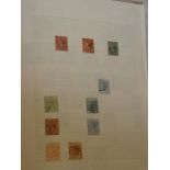 A folder album containing a selection of British West Indies stamps including Virgin Islands KGV