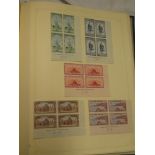 A folder album containing a collection of New Zealand stamps 1948-1967,