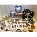 A large selection of various Star Wars toys including numerous figures, space-ships,