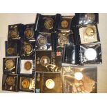 A selection of various commemorative crowns and coins including some silver examples,