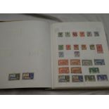 An album containing a collection of Gibraltar stamps,