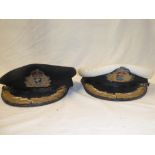 A Royal Naval Officer's peaked cap with King's Crown badge and one other Royal Naval Officer's