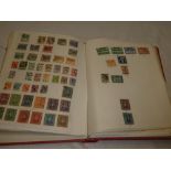 A folder album containing a selection of mixed World stamps including extensive Belgium,