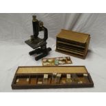A brass and painted metal monocular microscope by Hearson of London together with a selection of