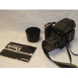 A Bronica ETRSi120 camera with instruction book