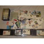 A box containing two cover albums, loose covers, first day covers,