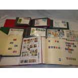 Five albums/stock books containing a selection of GB stamps,