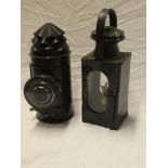 An unusual painted metal boat signal hand lantern with circular lens and one other painted metal