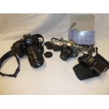 A Nikon F4 camera with Tamron 70-300mm tele-macro lens and a Nikon F55 camera (2)