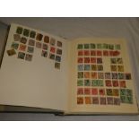 A folder album containing a collection of GB stamps including KGV definitives, KGVI £1 etc.