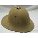 A First War Khaki Pith Helmet with liner and chin strap