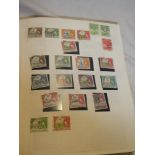 A folder album containing a collection of British Africa stamps including a wide range of countries