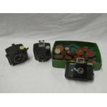 Two Kodak 3 Baby bakelite cameras together with various filters etc.
