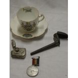 A Boer War china teacup and saucer with Patriot emblems;
