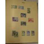 A folder album containing a collection of Malta mint and used stamps 1946-1977