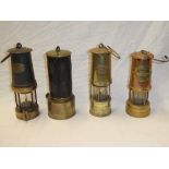 Three various mining-style lamps including Prima, British Coal Mining and G.P.O.