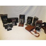 Seven various folding cameras including Zeiss Ikon; No.