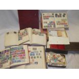 Various old albums of mixed World stamps together with tins and boxes of stamps,
