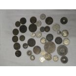 A selection of mixed Foreign coins including some silver examples, Chinese cash coins etc.
