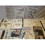 Various albums and files containing a selection of mint and used GB stamps together with World