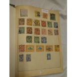 A folder album containing a collection of China mint and used stamps including some early examples