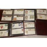Various albums containing a selection of GB and world first day covers together with empty albums