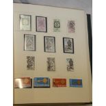 A folder album containing a comprehensive collection of Ireland stamps including a good range of