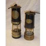 An old brass and painted metal bonnetted miner's lamp by Ackroyd & Best Limited and one other brass