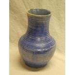 An unusual Moorcroft pottery tapered vase with blue lined decoration 9" high