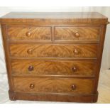 A Victorian mahogany chest of two short and three long drawers with turned handles on plinth base