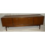 A 1960's G-Plan teak sideboard by E Gomme with chromium plated mounts,