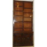 A 19th Century mahogany bookcase with adjustable shelves enclosed by two glazed doors above open