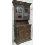 A 19th century Continental carved oak slim dresser with a single drawer in the frieze and cupboard