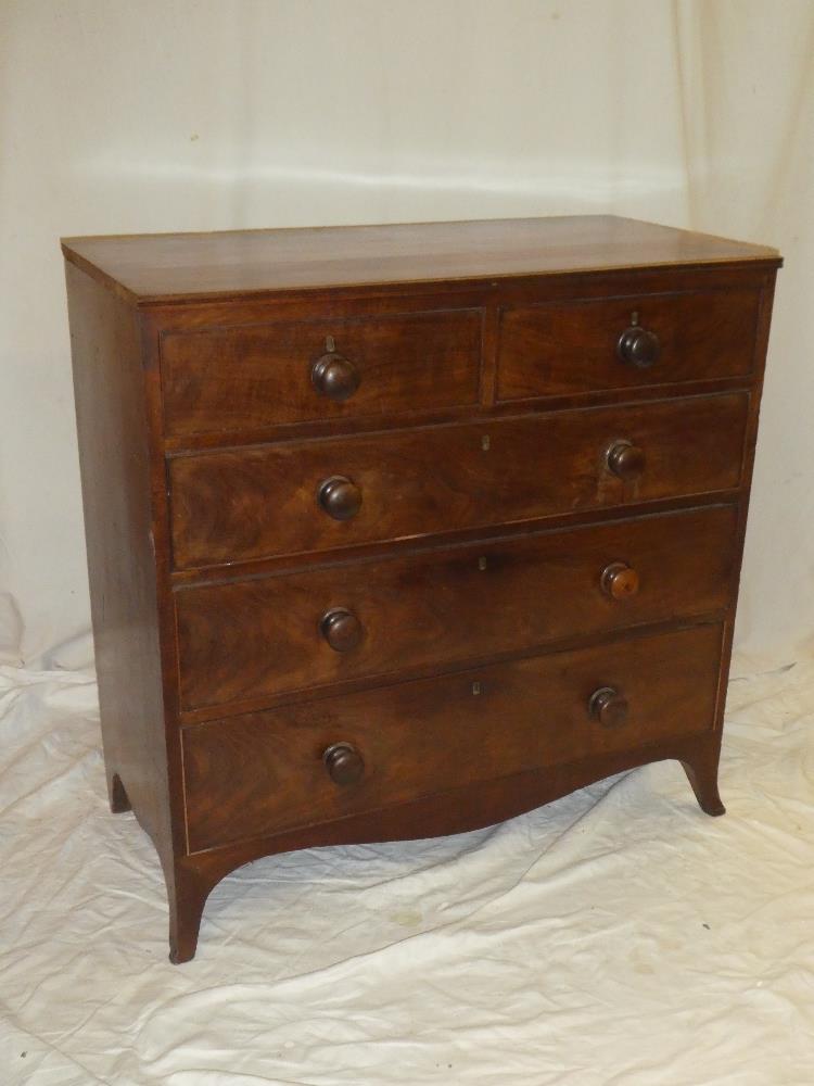 A Victorian mahogany chest of two short and three long drawers with turned handles on bracket feet